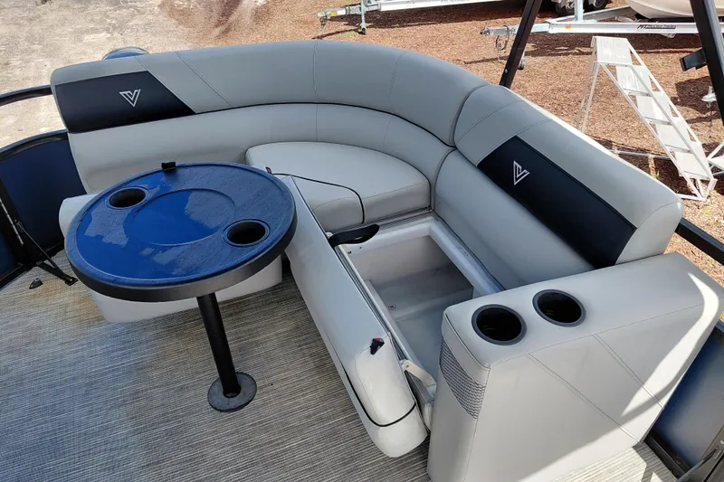 Slide: The Image of Luxurious seating area on 2023 Viaggio Del Mar C boat with table and cup holders. - 28