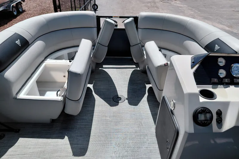 Slide: The Image of 2023 Viaggio Del Mar C pontoon boat interior with gray seating and control panel. - 17