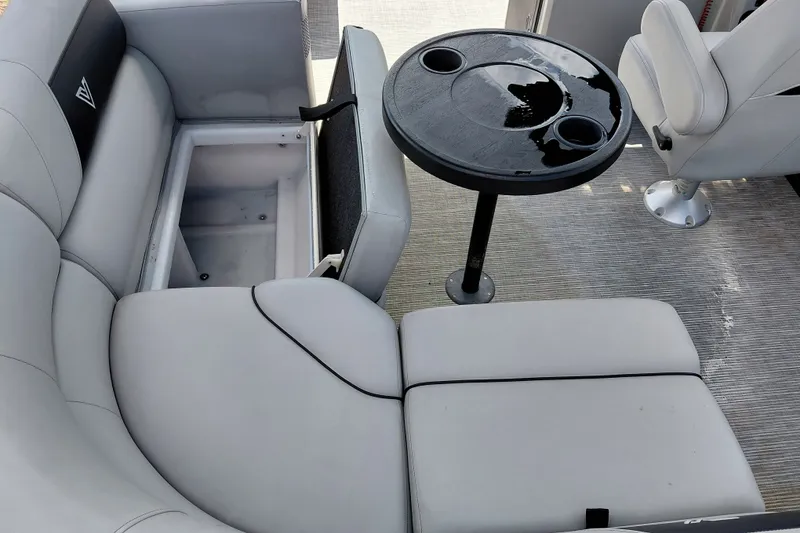 Slide: The Image of 2023 Viaggio Del Mar C boat interior with seating, table, and storage compartment. - 30