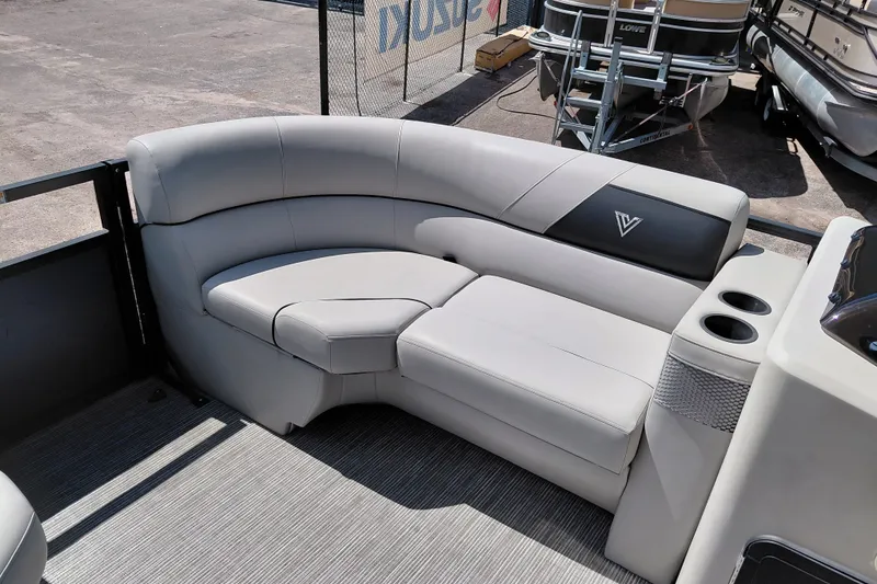 Slide: The Image of 2023 Viaggio Del Mar C boat interior with gray seating and cup holders. - 16