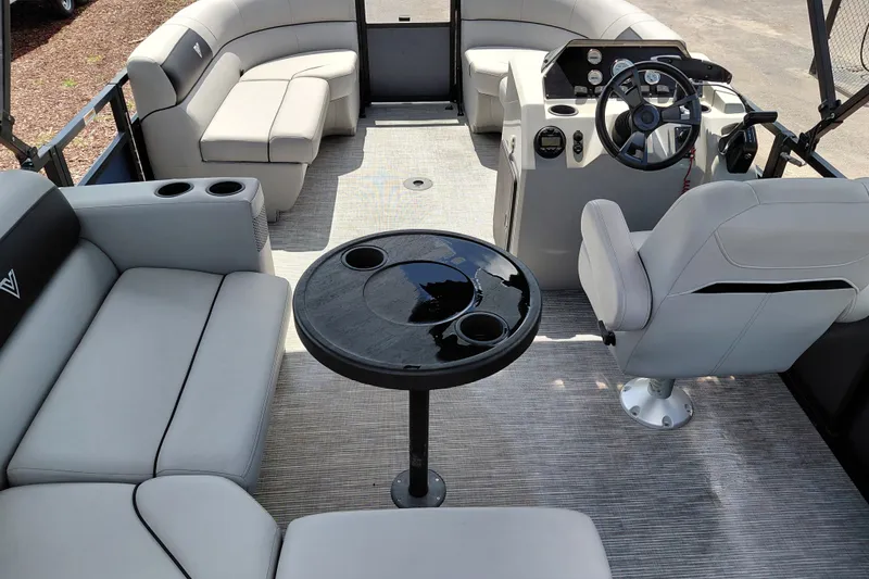 Slide: The Image of 2023 Viaggio Del Mar C pontoon boat interior with plush seating and modern helm. - 34