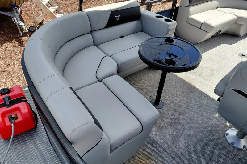 Slide: The Image of Luxurious seating area on 2023 Viaggio Del Mar C boat with round table and cup holders. - 27