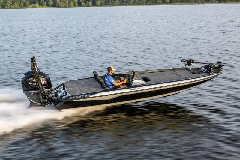 The Image of Manufacturer Provided Image: 2024 Skeeter ZXR20 boat speeding on a lake, showcasing sleek design and performance. - 1