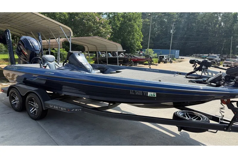 The Image of 2022 Skeeter ZXR20 bass boat on trailer, parked outdoors. - 0