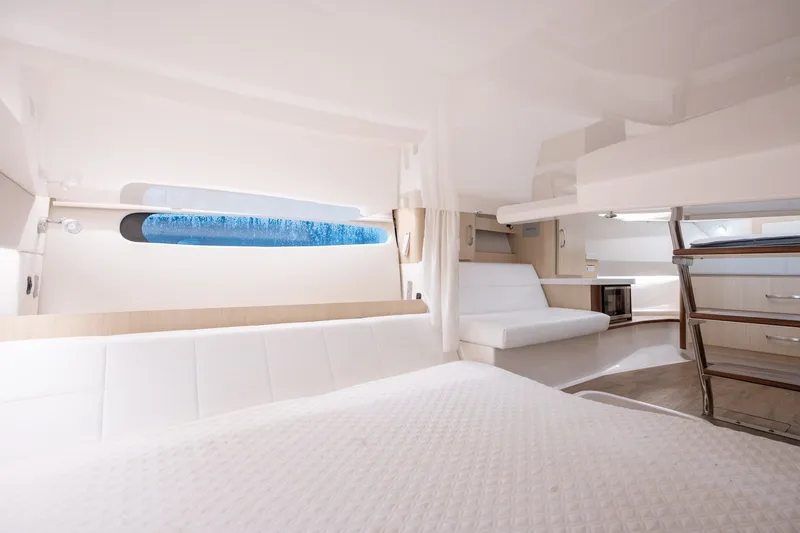 Slide: The Image of Luxurious interior of 2025 Regal 36 Grande Coupe yacht with modern furnishings and elegant design. - 54