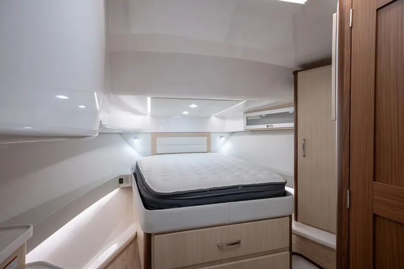 Slide: The Image of Luxurious interior cabin of 2025 Regal 36 Grande Coupe yacht with modern furnishings. - 42