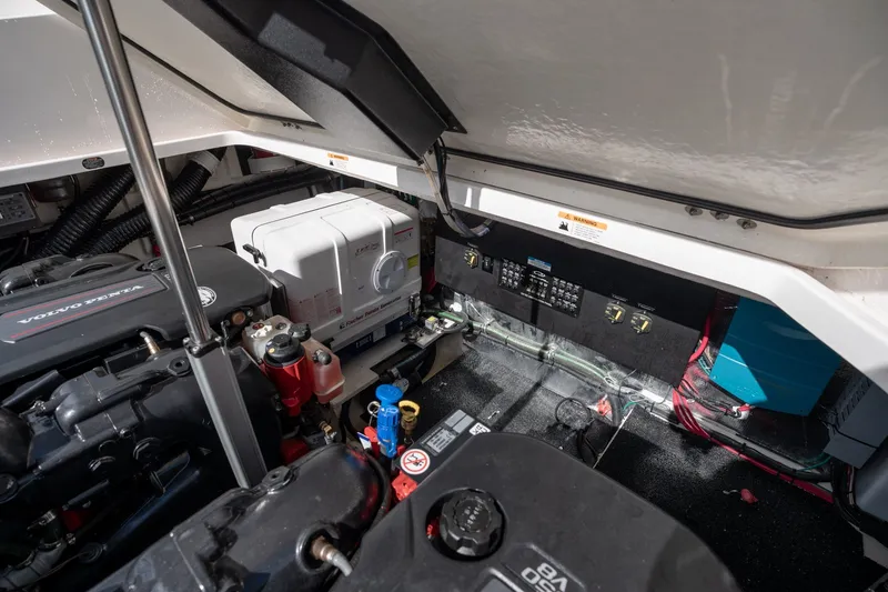 Slide: The Image of Engine compartment of 2025 Regal 36 Grande Coupe, featuring Volvo Penta engine and electrical components. - 57