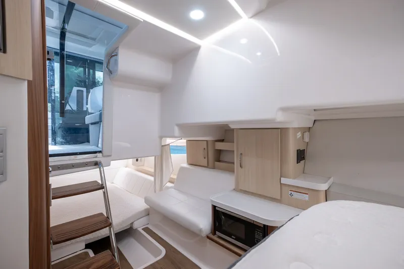 Slide: The Image of Luxurious interior of 2025 Regal 36 Grande Coupe yacht with modern amenities and sleek design. - 45
