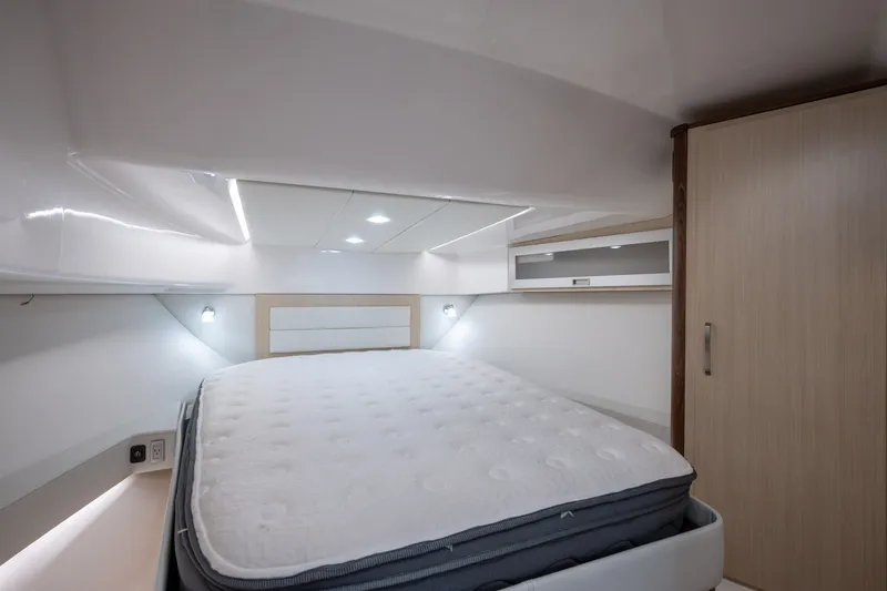 Slide: The Image of Interior cabin of 2025 Regal 36 Grande Coupe with bed and storage. - 43