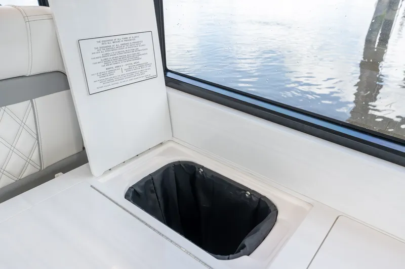 Slide: The Image of Interior of 2025 Regal 36 Grande Coupe with built-in trash compartment. - 26
