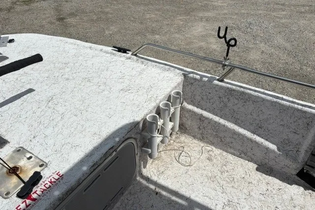 Slide: The Image of 2001 Polar 1780 Flat boat deck with rod holders and tackle storage. - 19