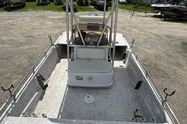 Slide: The Image of 2001 Polar 1780 Flat boat interior with seating and fishing rod holders. - 10