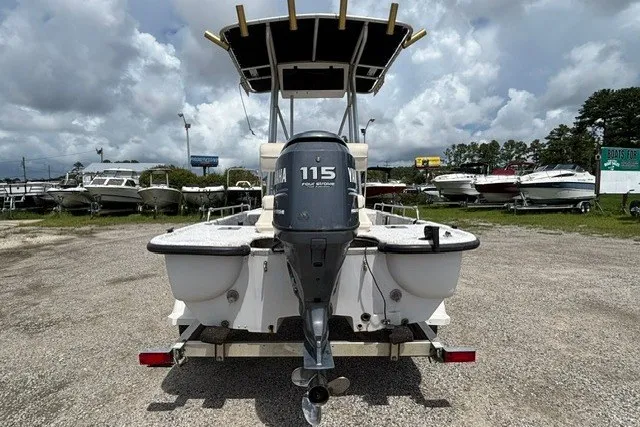 Slide: The Image of 2001 Polar 1780 Flat boat with Yamaha 115 engine, parked in a boatyard. - 3