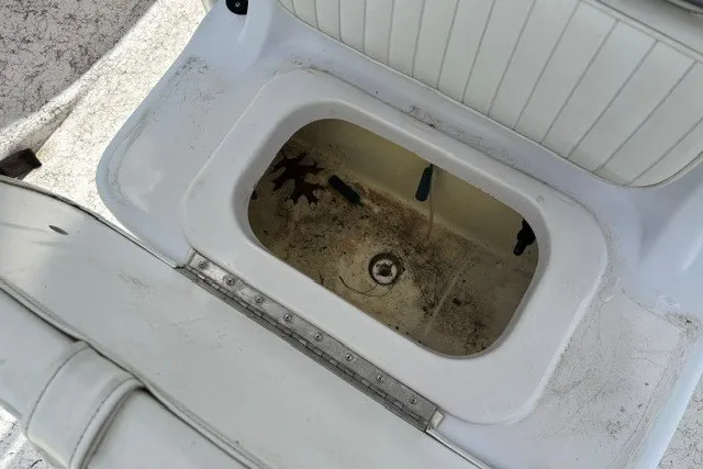 Slide: The Image of 2001 Polar 1780 Flat boat seat storage compartment, open and empty. - 21