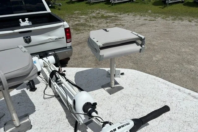 Slide: The Image of 2001 Polar 1780 Flat boat with motor, parked near a white truck. - 18