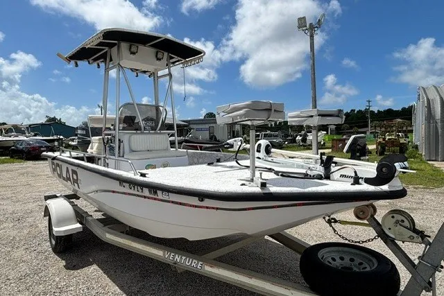 Slide: The Image of 2001 Polar 1780 Flat boat on trailer under blue sky. - 4