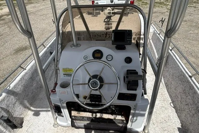 Slide: The Image of 2001 Polar 1780 Flat boat console with steering wheel and navigation equipment. - 14