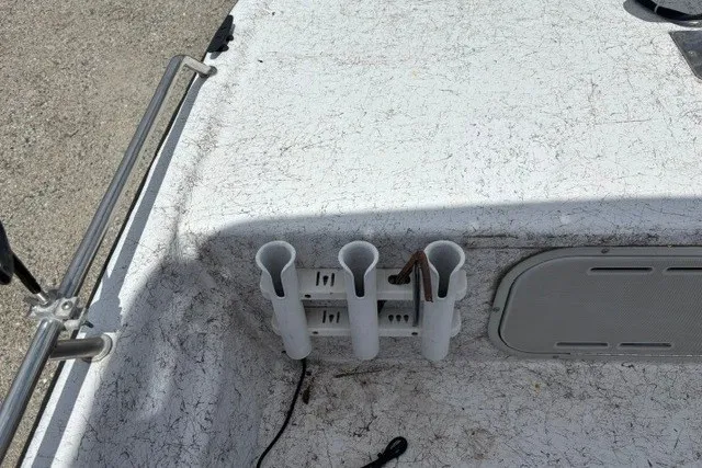 Slide: The Image of 2001 Polar 1780 Flat boat deck with rod holders and storage compartment. - 16