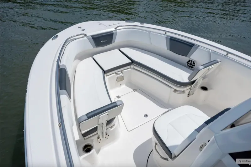 Slide: The Image of 2021 Robalo R272 Center Console boat interior with cushioned seating and sleek design. - 10