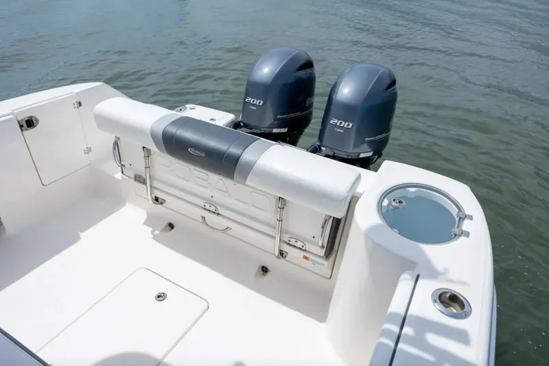 Slide: The Image of 2021 Robalo R272 Center Console boat with twin 200 horsepower engines on water. - 4