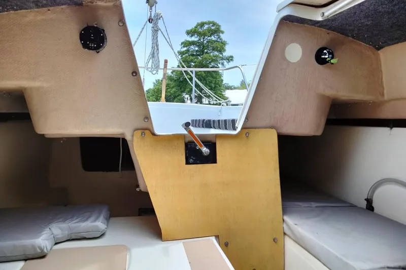 Slide: The Image of Interior view of a 1980 MacGregor 25 sailboat cabin with sleeping berths. - 12
