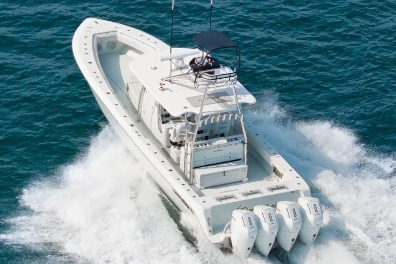 Slide: The Image of 2026 Contender 44 ST boat cruising on open water with powerful engines. - 10
