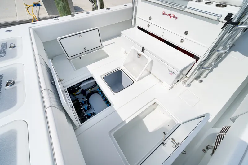 Slide: The Image of 2026 Contender 44 ST boat interior with open storage compartments and sleek design. - 23