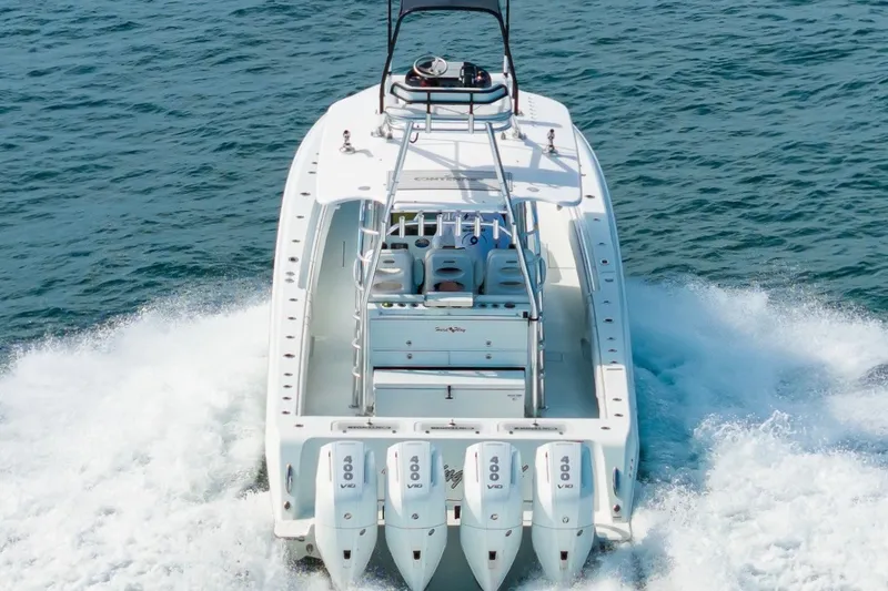 Slide: The Image of 2026 Contender 44 ST boat cruising on open water with powerful engines. - 1