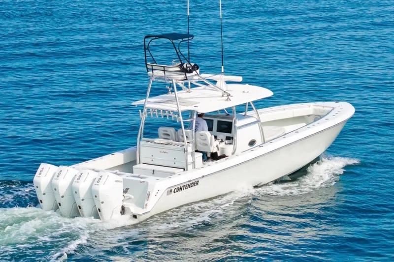 Slide: The Image of 2026 Contender 44 ST boat cruising on open water with four powerful engines. - 4