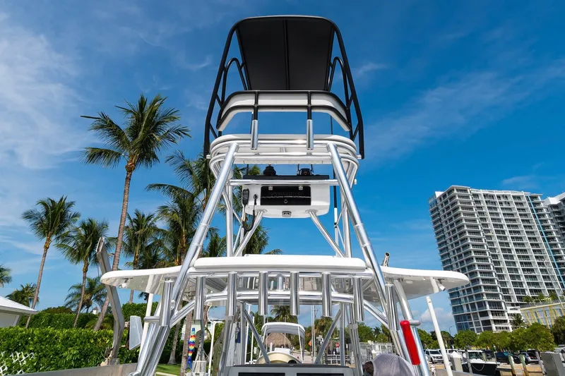 Slide: The Image of 2026 Contender 44 ST boat with tower, palm trees, and skyscraper in the background. - 29