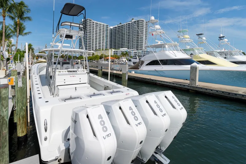 Slide: The Image of 2026 Contender 44 ST boat docked with four Mercury 400 V10 engines. - 27