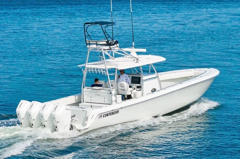Slide: The Image of 2026 Contender 44 ST boat cruising on blue water with four powerful engines. - 6