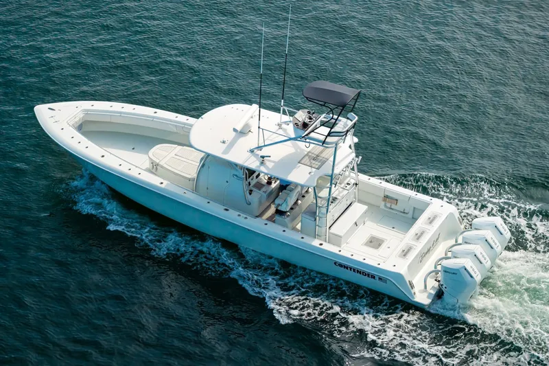 Slide: The Image of 2026 Contender 44 ST boat cruising on open water with powerful engines. - 14