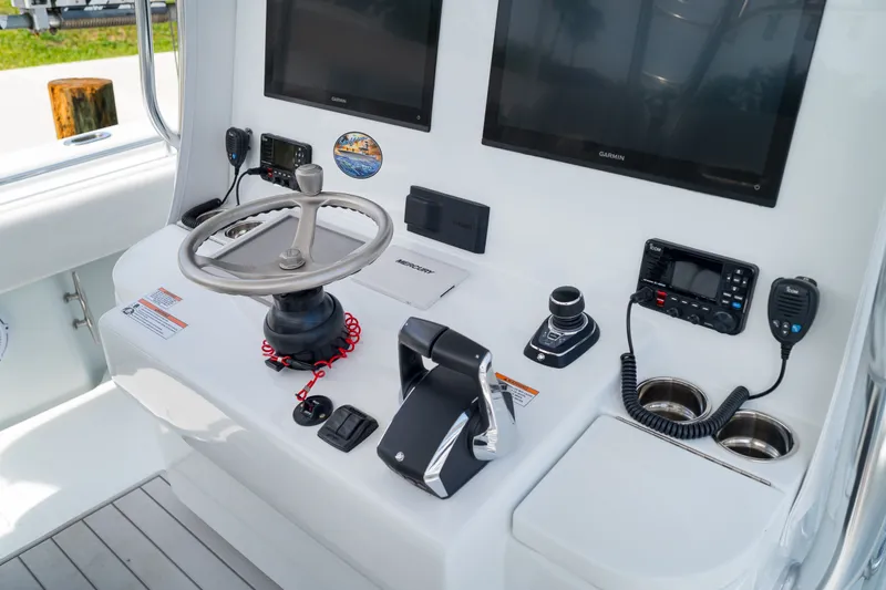 Slide: The Image of Helm of 2026 Contender 44 ST boat with advanced navigation and control systems. - 16