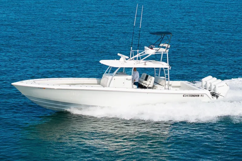 Slide: The Image of 2026 Contender 44 ST boat cruising on blue ocean waters. - 7
