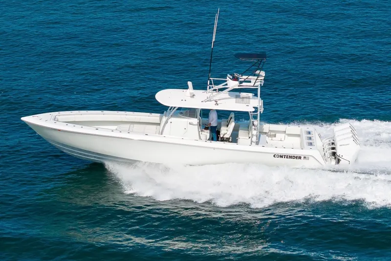 Slide: The Image of 2026 Contender 44 ST boat cruising on open blue water. - 9