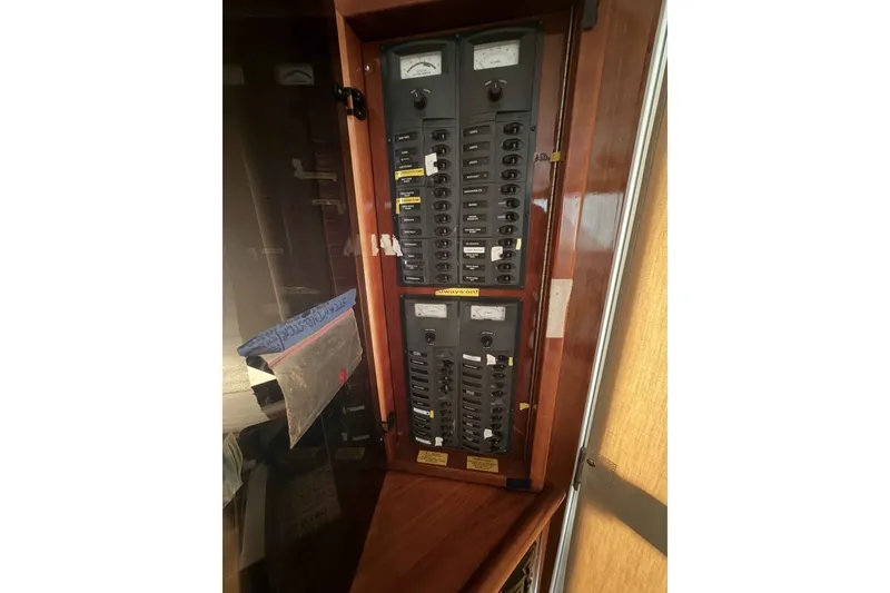 Slide: The Image of Electrical panel inside 2000 Riviera 48 Convertible yacht, featuring switches and meters. - 14
