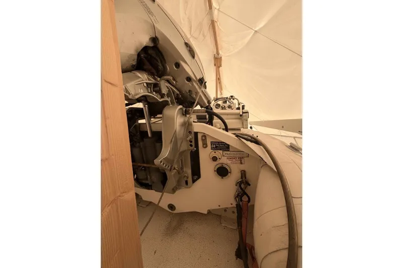 Slide: The Image of Engine compartment of a 2000 Riviera 48 Convertible boat under a protective cover. - 2