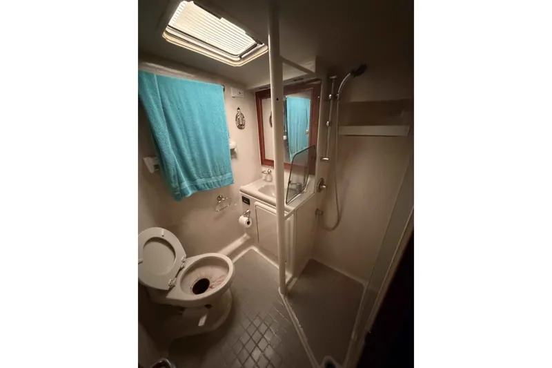 Slide: The Image of Bathroom interior of 2000 Riviera 48 Convertible yacht with shower and toilet. - 17