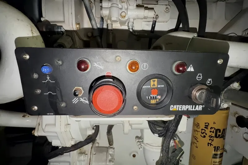 Slide: The Image of Control panel of a Caterpillar engine on a 2000 Riviera 48 Convertible yacht. - 9