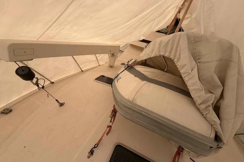 Slide: The Image of Covered inflatable boat on 2000 Riviera 48 Convertible yacht deck. - 3