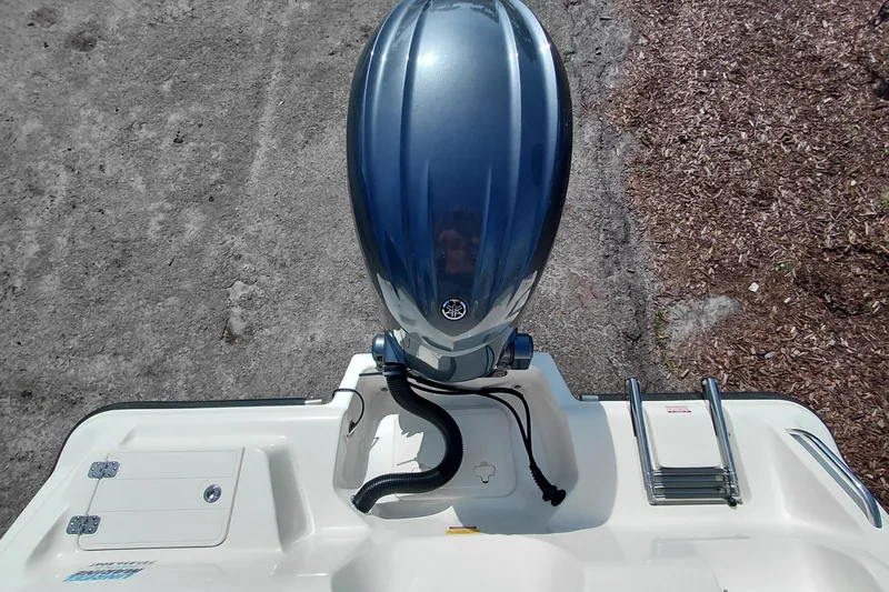 Slide: The Image of 2024 Key West 219 FS boat with Yamaha outboard motor, viewed from above. - 32