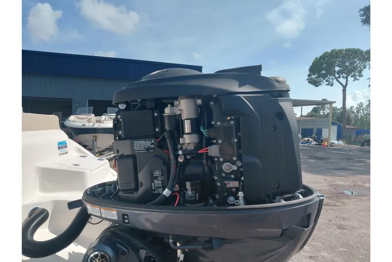 Slide: The Image of 2024 Key West 219 FS boat engine, detailed view under sunny sky. - 42
