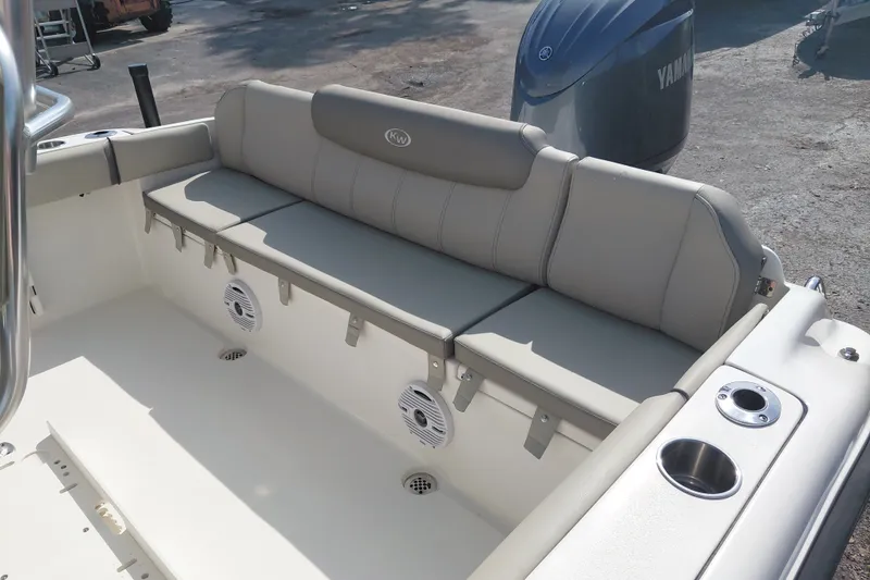 Slide: The Image of 2024 Key West 219 FS boat interior with cushioned seating and Yamaha engine. - 26