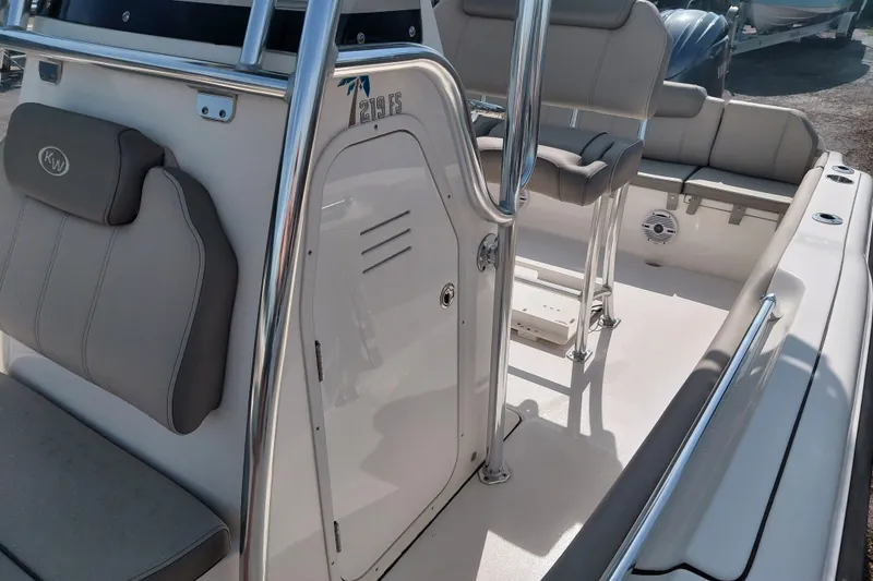 Slide: The Image of 2024 Key West 219 FS boat interior with seating and console details. - 19