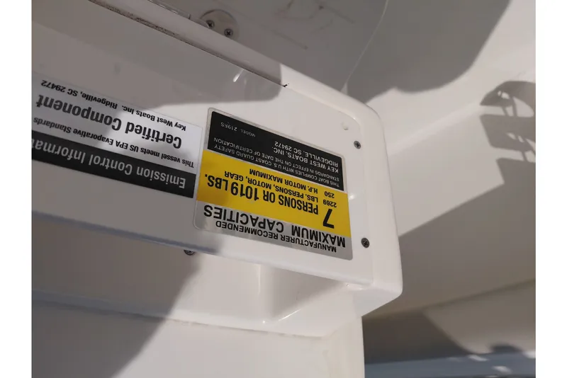 Slide: The Image of 2024 Key West 219 FS boat capacity label, showing maximum weight and passenger limits. - 38