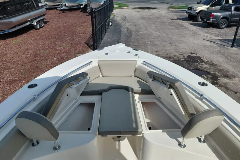 Slide: The Image of 2024 Key West 219 FS boat interior with seating and storage compartments. - 15
