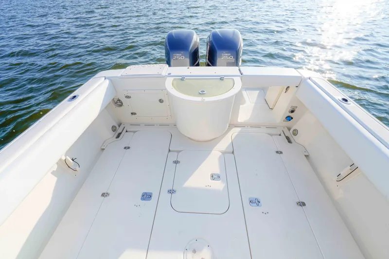 Slide: The Image of 2005 Pursuit 3480 Center Console boat with twin Yamaha 250 engines on open water. - 19