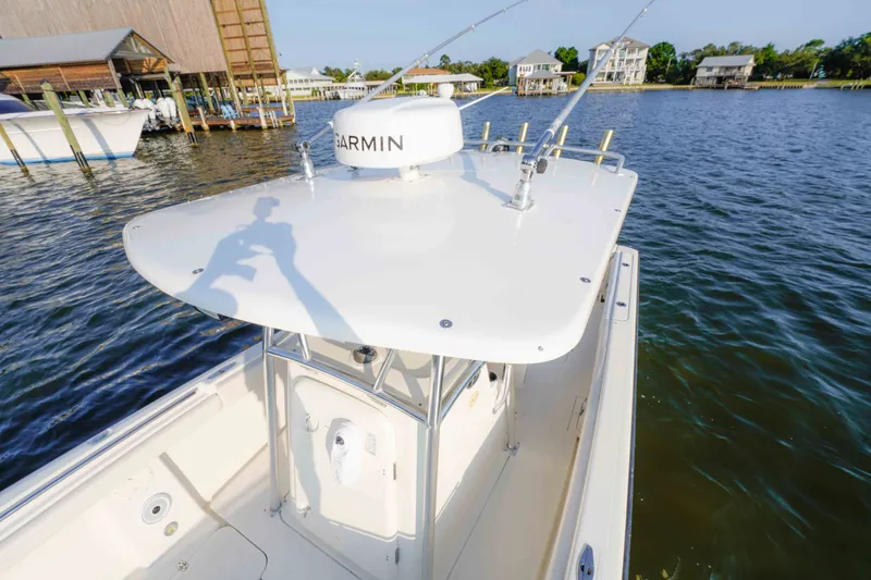 Slide: The Image of 2005 Pursuit 3480 Center Console boat with Garmin radar on calm waters. - 37
