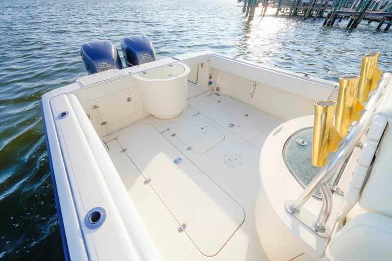 Slide: The Image of 2005 Pursuit 3480 Center Console boat deck with twin Yamaha 250 engines on water. - 17